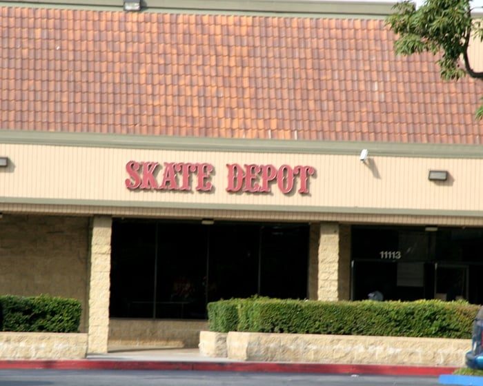 The Skate Depot entrance in a Cerritos plaza, a tile-roofed storefront with the Skate Depot sign over the doors
